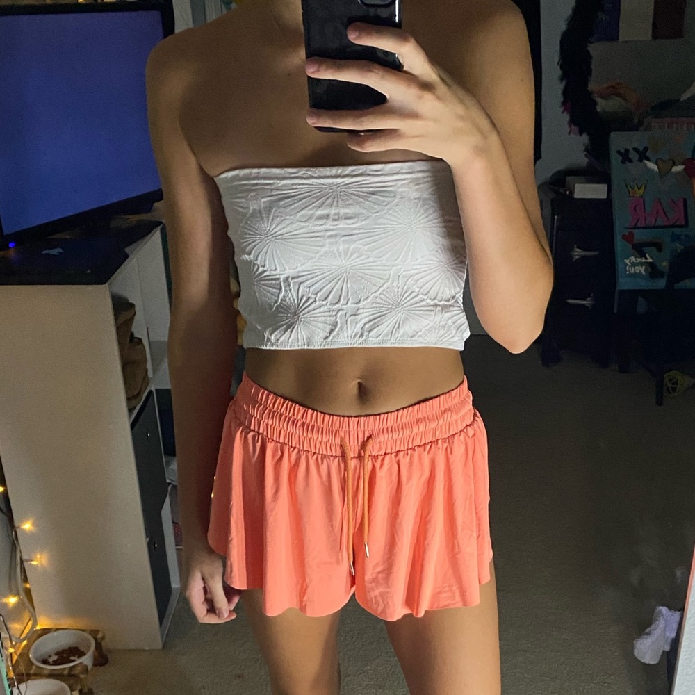 Popular orange athletic shorts with spandex underneath